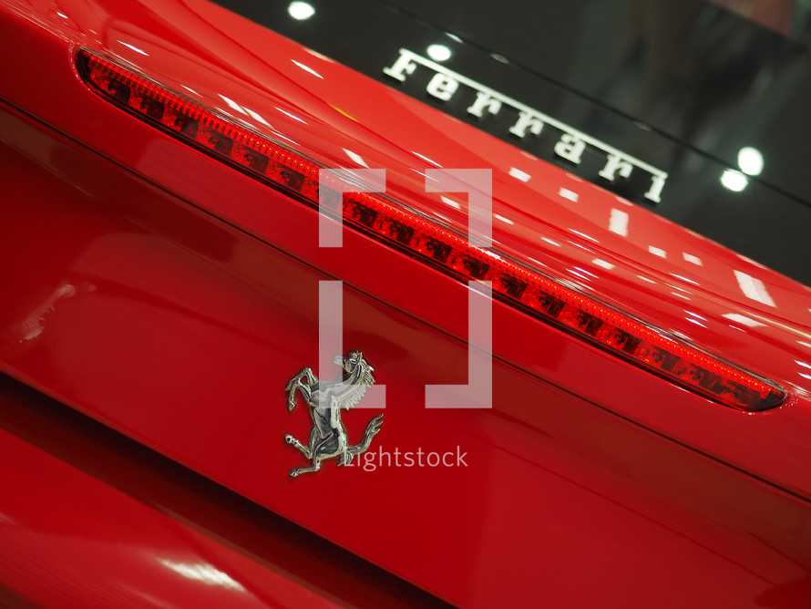 Red Ferrari 488 GTB in showroom. Fast italian sports car