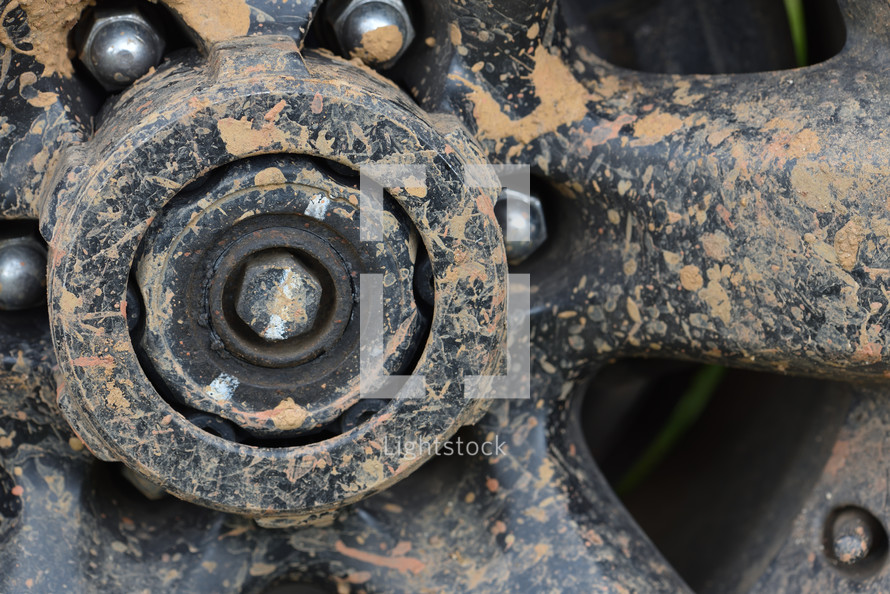 off-road car's wheel, covered in mud