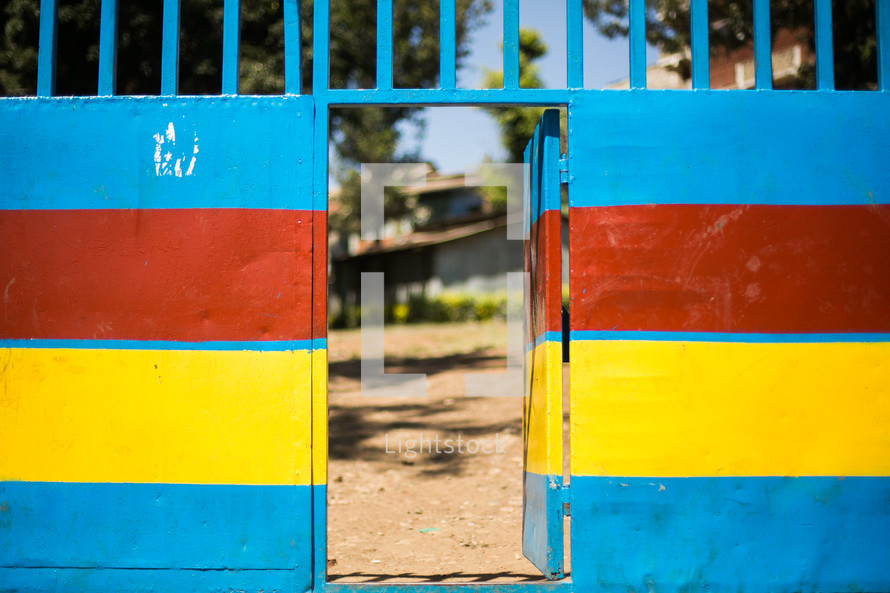 red, yellow, and blue wall and gate door 