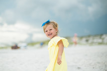 toddler girl on a beach 