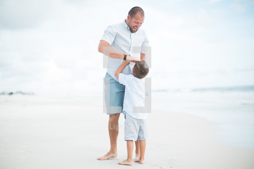 father and son on a beach 