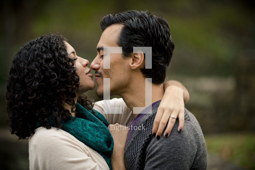 woman kissing the nose of a man