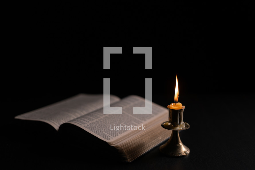 Bible and candlelight