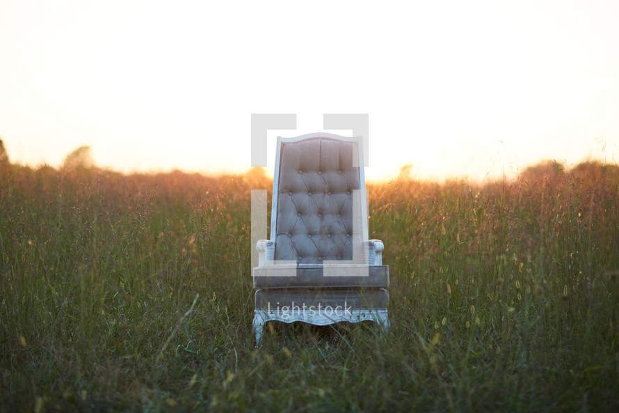 empty chair in a field 