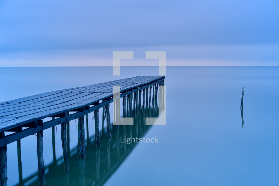 Wooden bridge at blue hour before sunrise view for beautiful background, long exposure