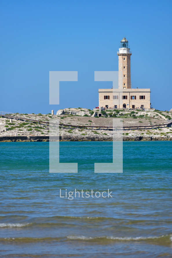 lighthouse from the coast of Vieste on a sunny day, Puglia region, Italy 