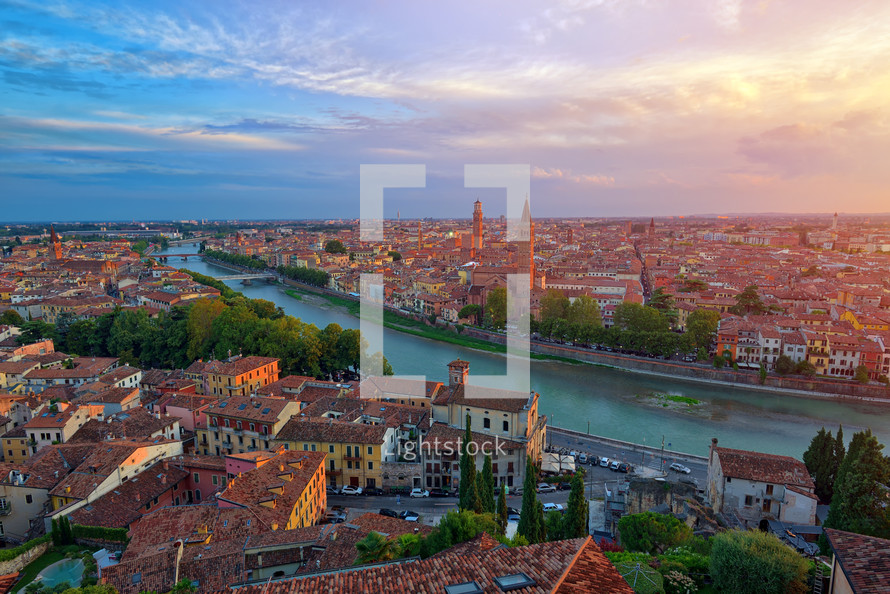 Panoramic aerial view of Verona, Italy at summer sunset, sun lens flare