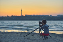 filming the sunset at a beach 