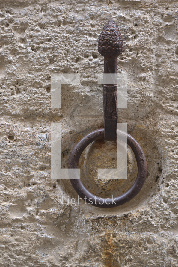 metal ring on a stone wall in Italy 