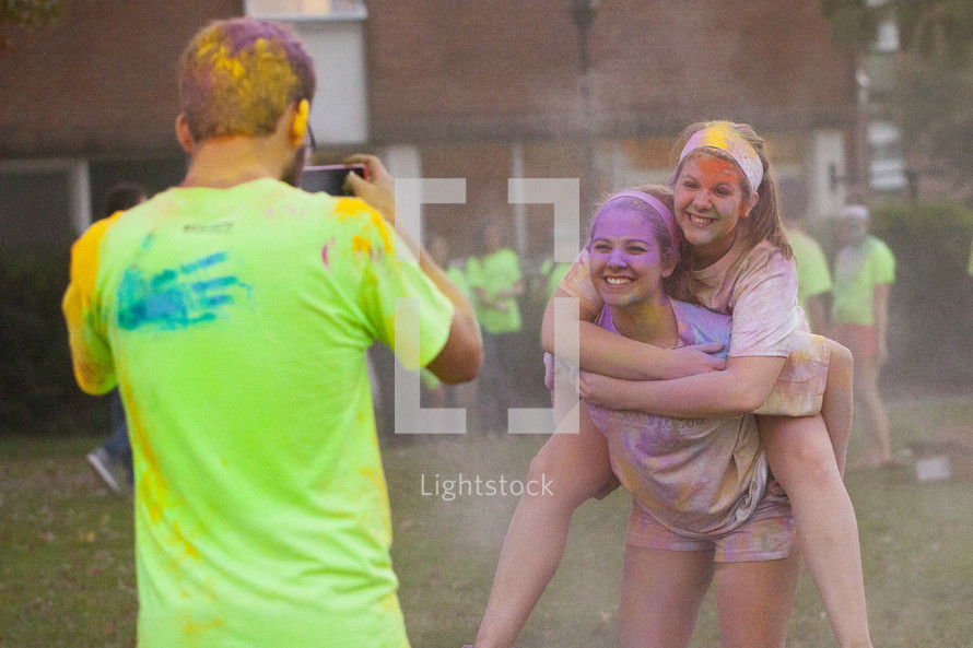 teens after a color run taking a picture 