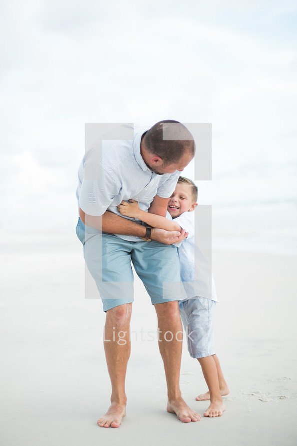 father and son on a beach 