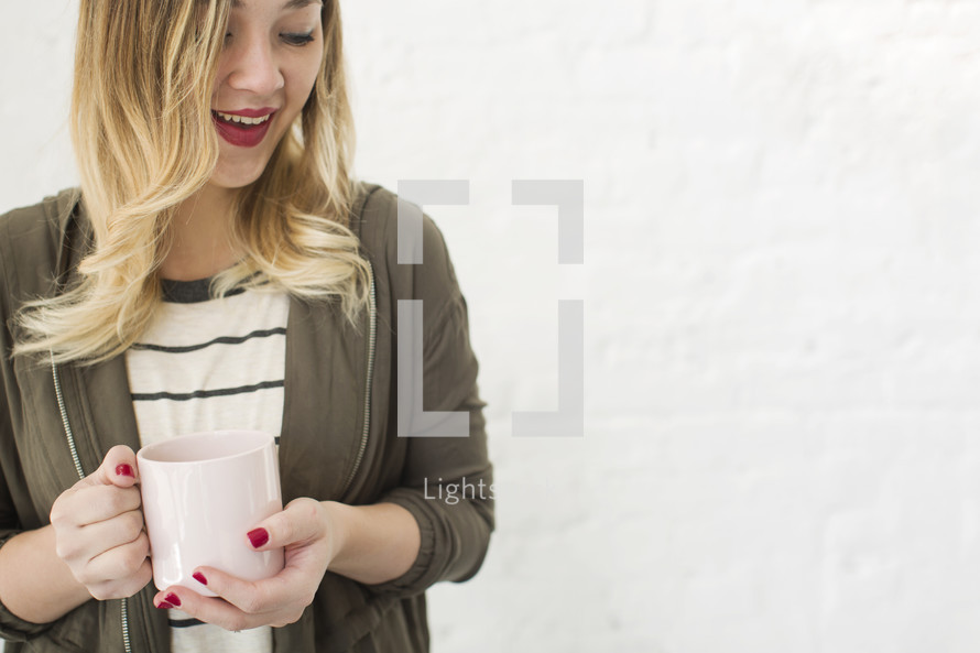 woman holding a coffee mug