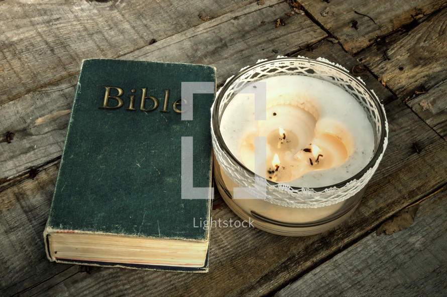 old Bible and candle 