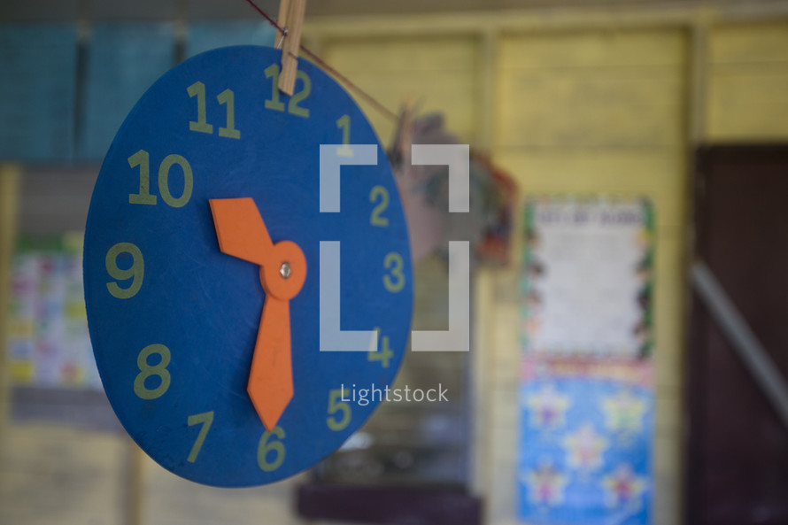 clock cut out in a classroom