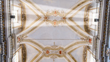 Ceiling with windows of a big majestic church cathedral in Italy