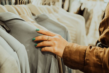 A close up of a woman's hand shopping