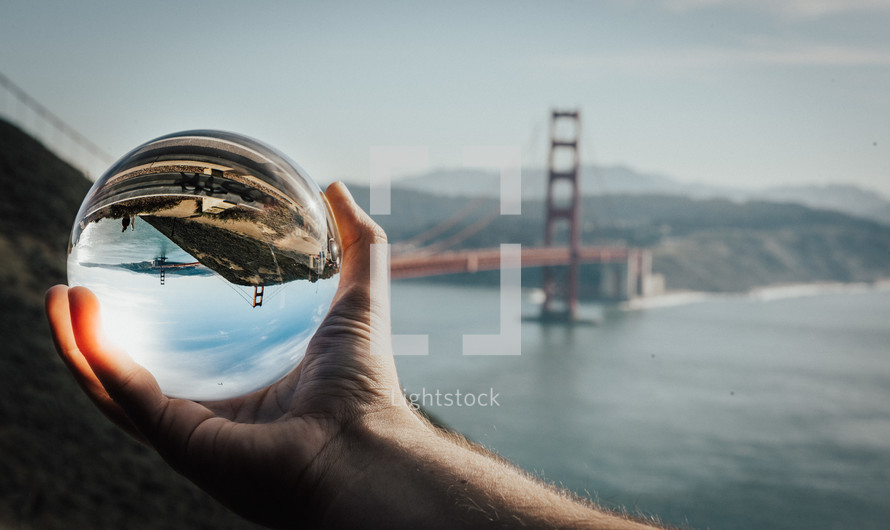 view of the Golden Gate Bridge through a glass orb