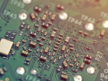 Closeup of PCB with small components on its surface. Electronics concept