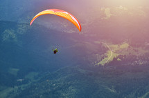 Paraglider taking off in front of spectacular mountain scenery