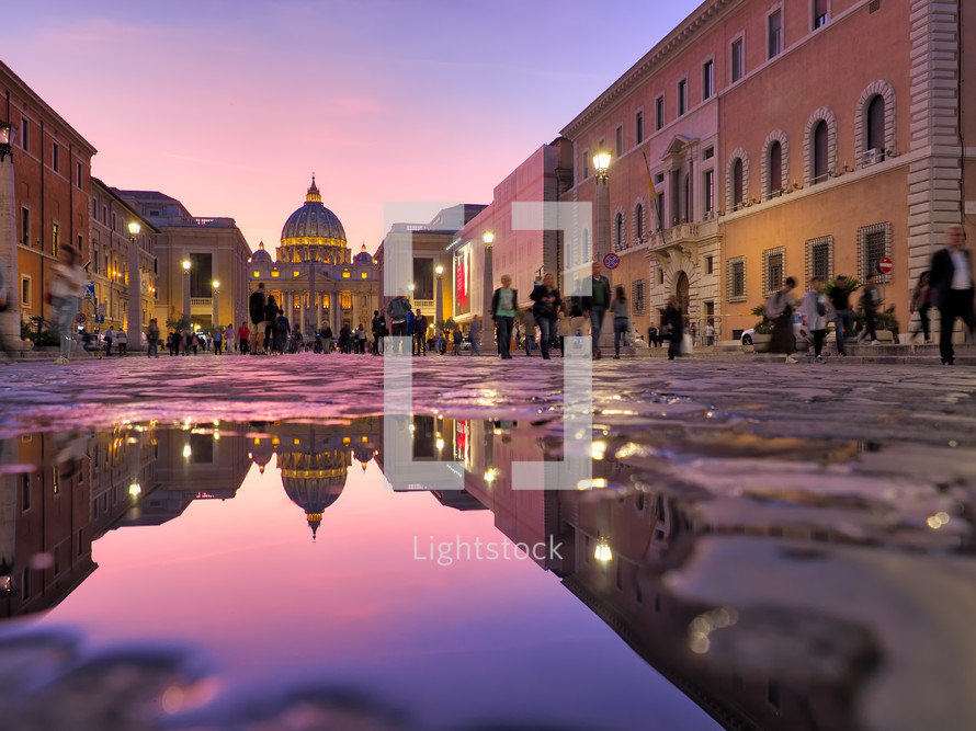  St Peter Cathedral, Vatican, Rome, Italy. Sunset sky with night city lights