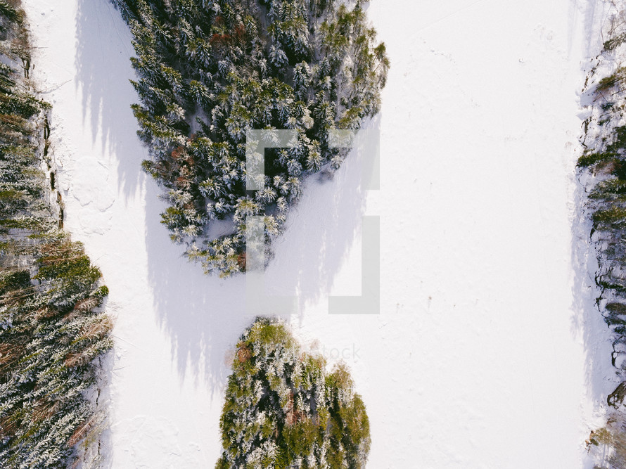 aerial view over a winter pine forest 