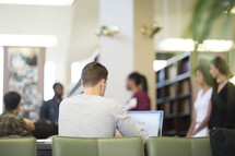 students studying in a library 
