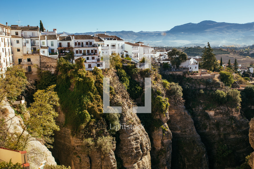 homes and villas along a mountainside cliff 