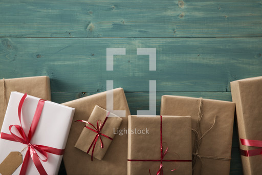 Border of wrapped gifts on a wood floor — Photo — Lightstock