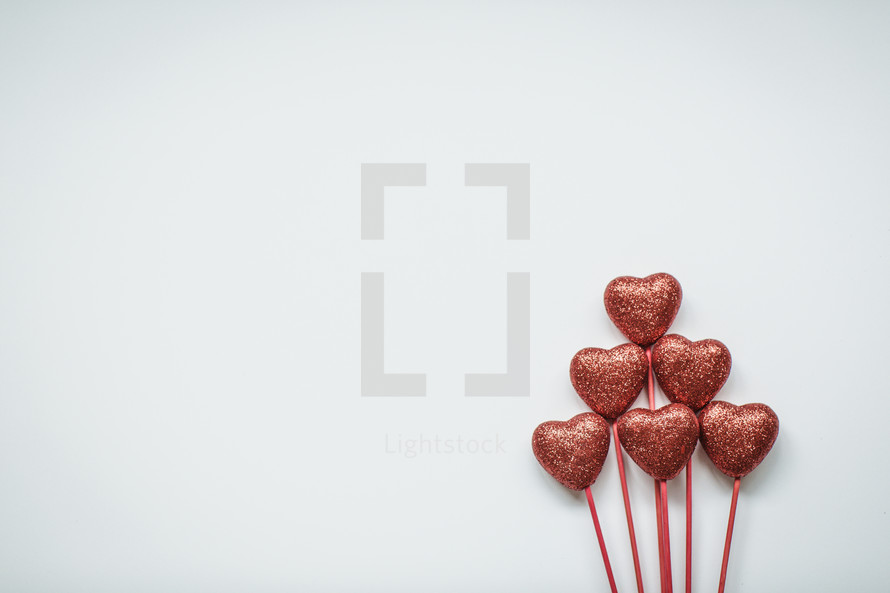 Hearts on sticks on a white background 