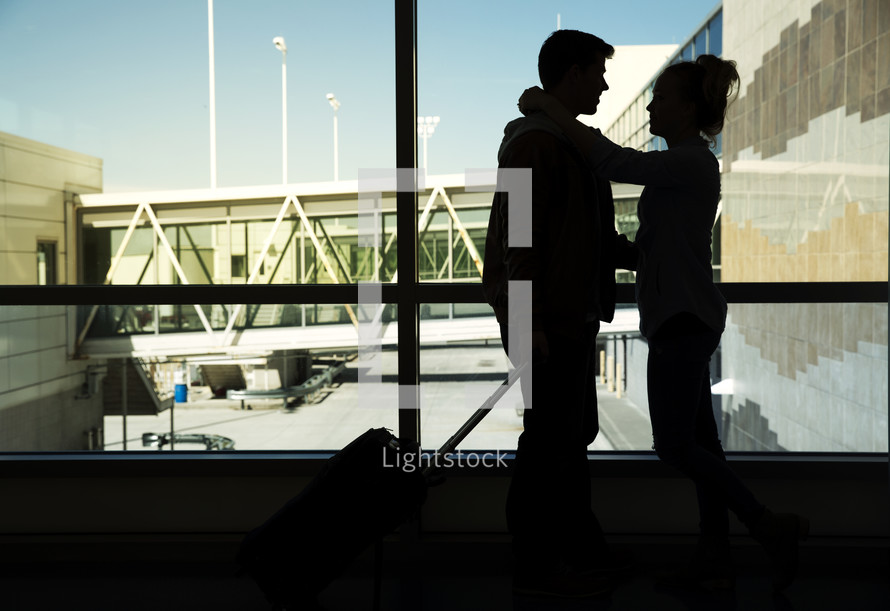 couple with luggage at the airport 