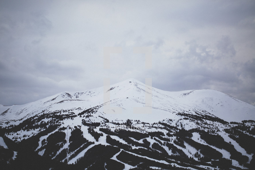 snow covered mountain peak and ski slopes 