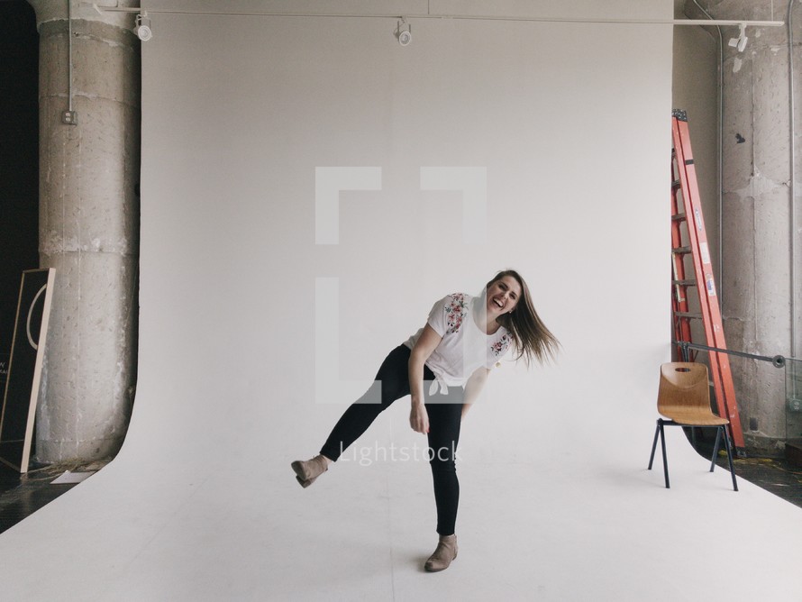 playful woman in a photo studio 