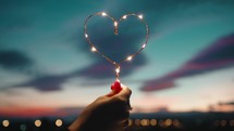 Holding A Heart Of Fairy Lights
