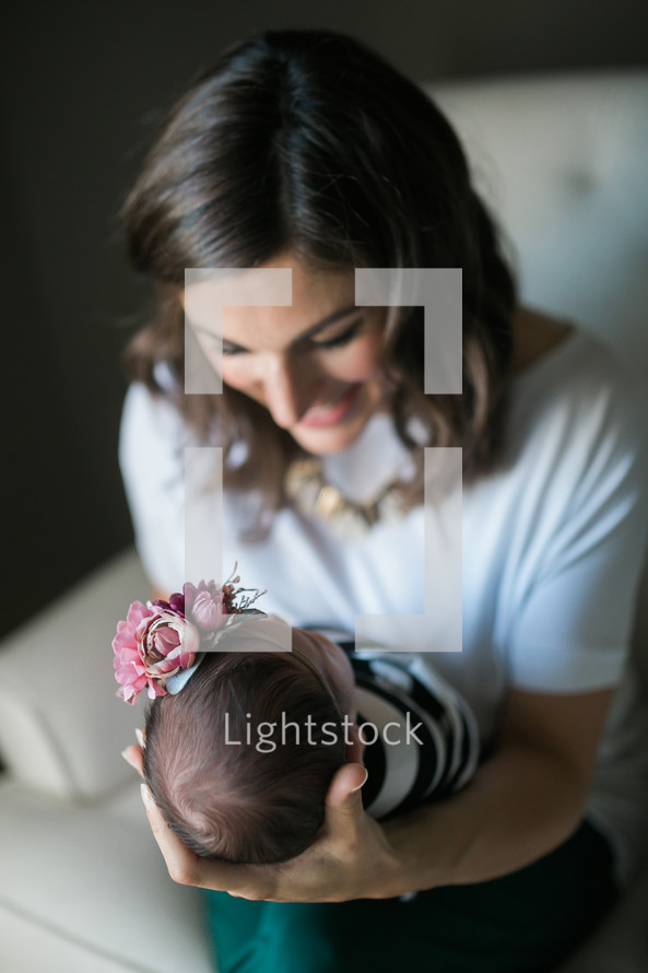 mother holding an infant  