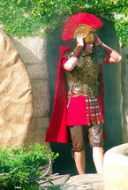 A bewildered  Roman soldier looks on in disbelief as he discovers the empty tomb of Jesus Christ with the stone rolled away and  Jesus body nowhere to be found. The primary colors are red and green and bright and vivid as it shows the emotion, fear and  disbelief of this roman solider as he goes on duty to find the empty tomb of Christ. The fear of the Roman army was that the body of Jesus would be stolen to validate the belief that Jesus would resurrect Himself from the dead. 