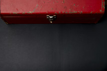 red toolbox on a black background 