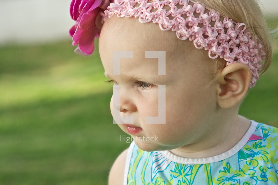 profile of toddler girl in a head band