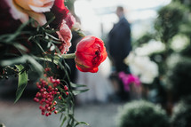 distant groom and wedding flowers 