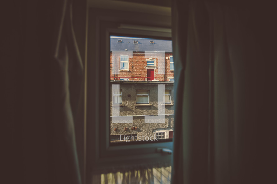 view of buildings through a window 