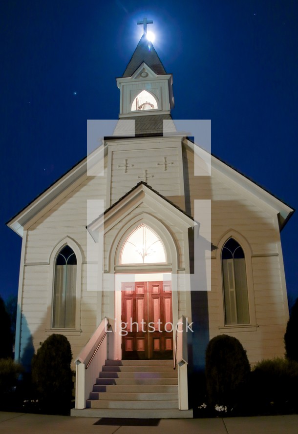 white church with steeple at night