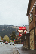 Antler Motel town square inn and cars traveling down a street 