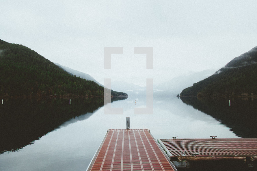 dock over a foggy lake 