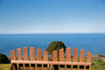 adirondack bench overlooking the ocean 
