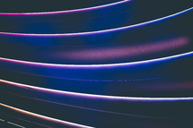 black, blue, white, and purple streaks abstract background 