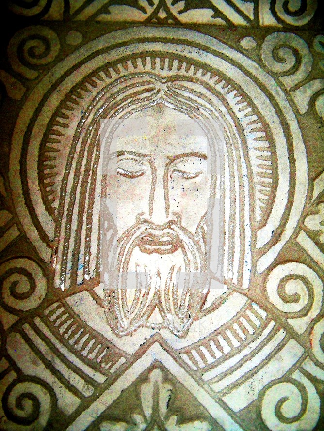A mosaic image of Jesus Christ engraved in stone. 