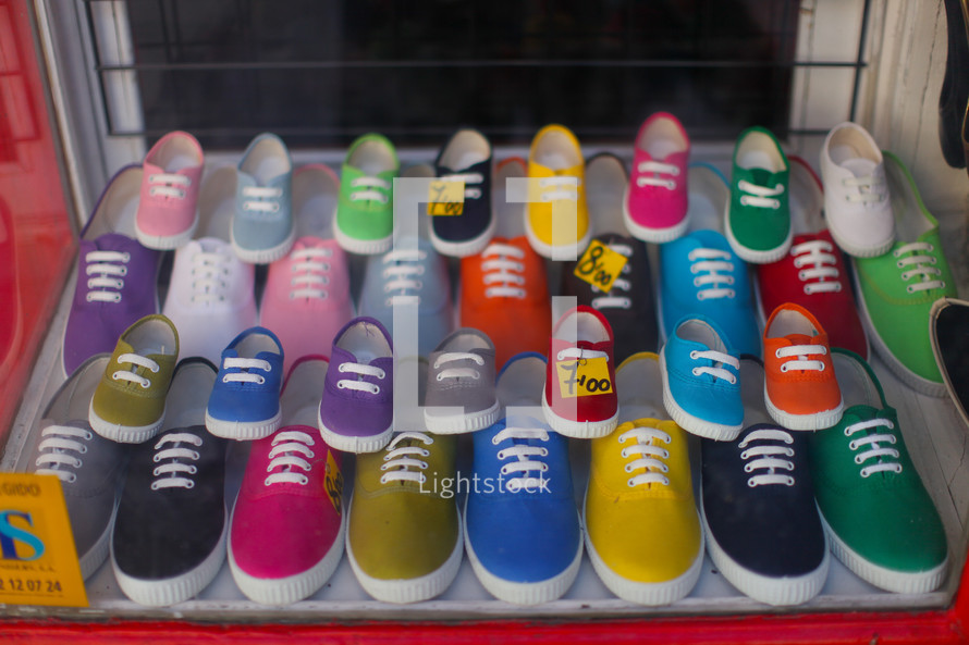 Colorful tennis shoes in store window