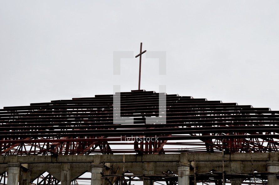 Cross on top of a church in construction 