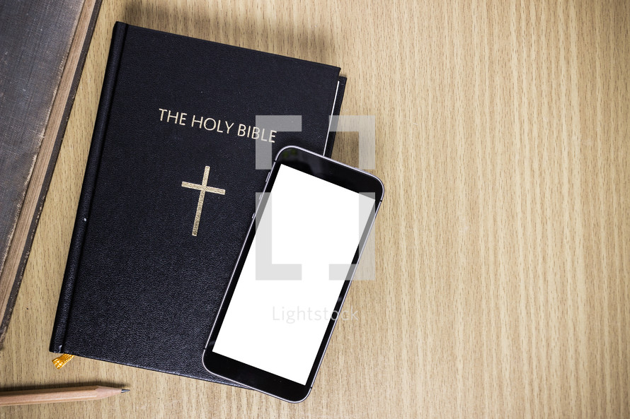 Bible and cellphone overhead view 