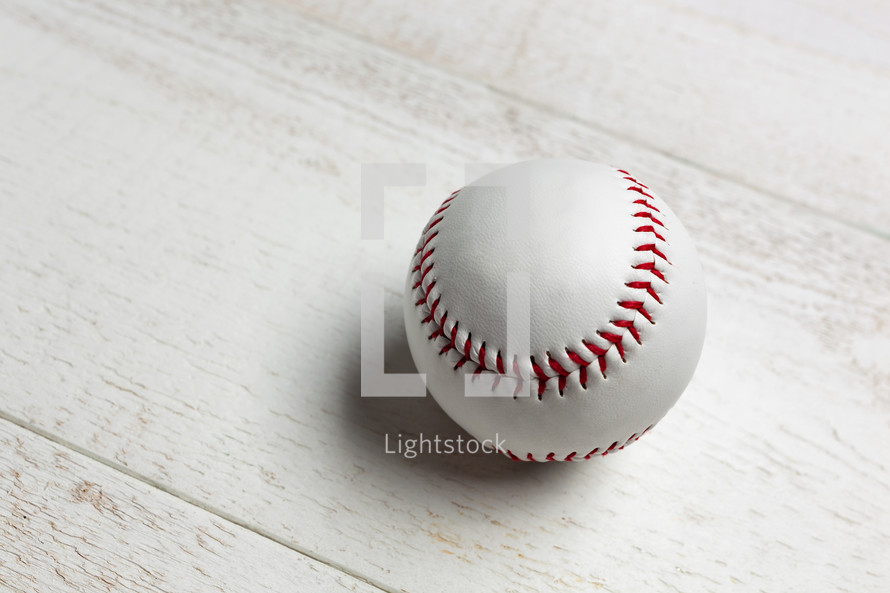 Baseball on a white wood background 