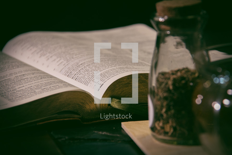 jars of spices and open Bible 